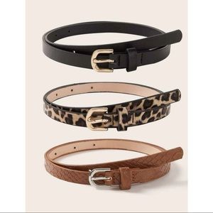 Leopard print, black, and brown belts with buckle